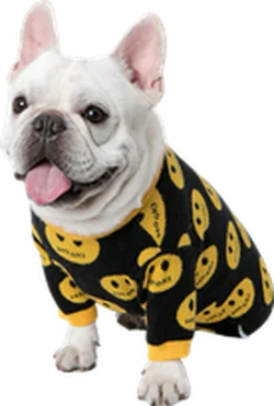 A white French Bulldog wearing a black long-sleeve dog pajama top with a yellow smiley face pattern, shown against a plain white background.